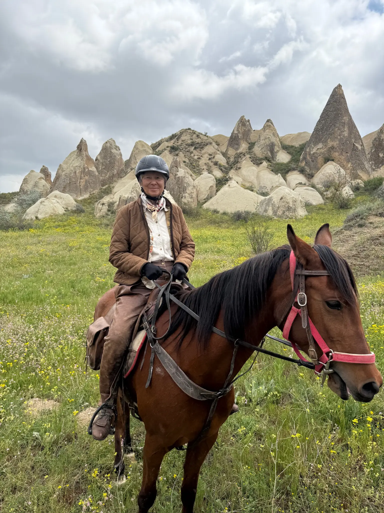 Horseback riding among fairy chimneys in Cappadocia valleys